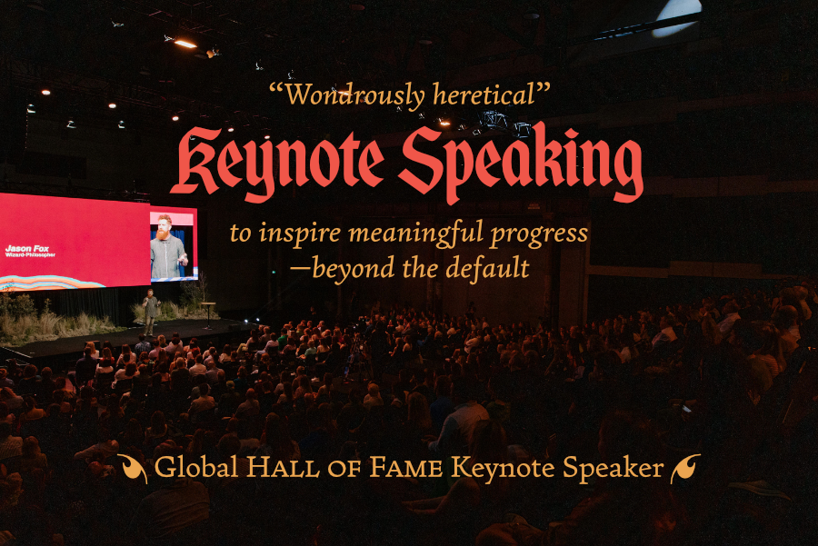 “Wondrously heretical” Keynote Speaking to inspire meaningful progress—beyond the default. This image shows global hall of fame keynote speaker Dr. Jason Fox on stage in front of a large audience.